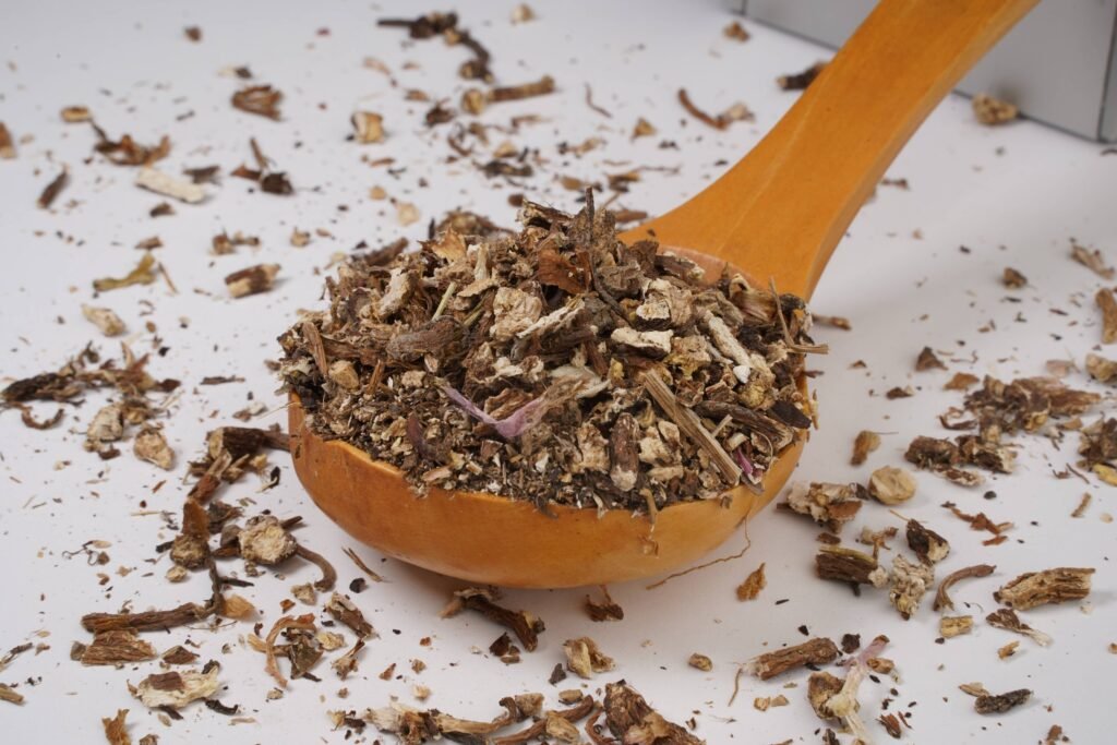 Loose Dandelion Root Tea in a wood spoon