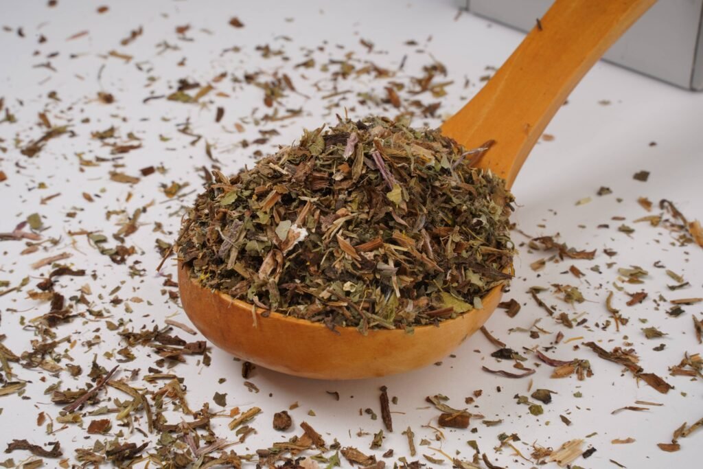 Loose Dandelion Leaf Tea by BalkanHerb in a wood spoon.